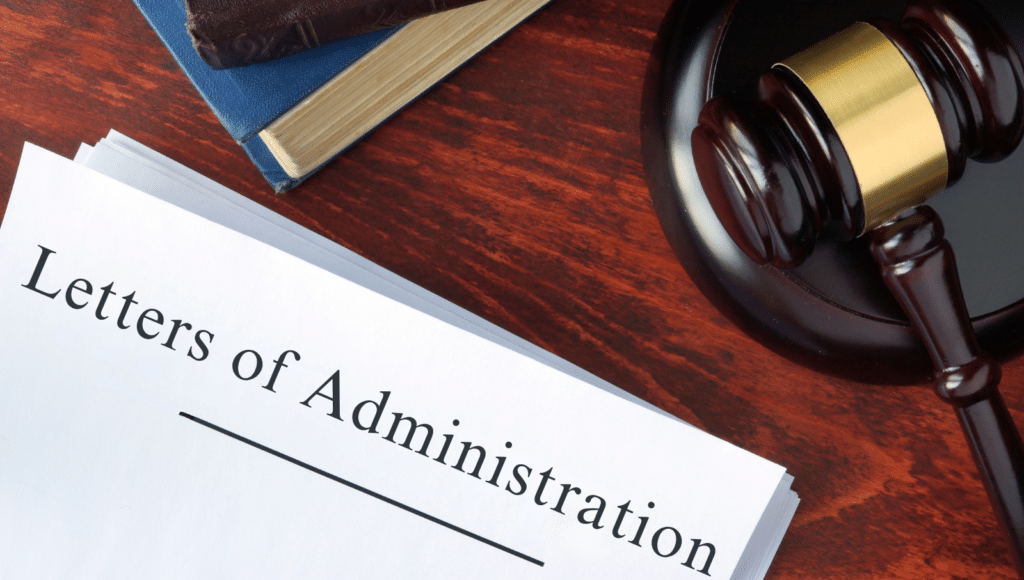 Legal document labeled “Letters of Administration” next to a gavel on a wooden desk